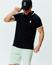 Mens Holden Pique Polo, black classic fit pique polo with white tipped collar and cuffs, featuring a small embroidered white Psycho Bunny skull logo on the left chest.