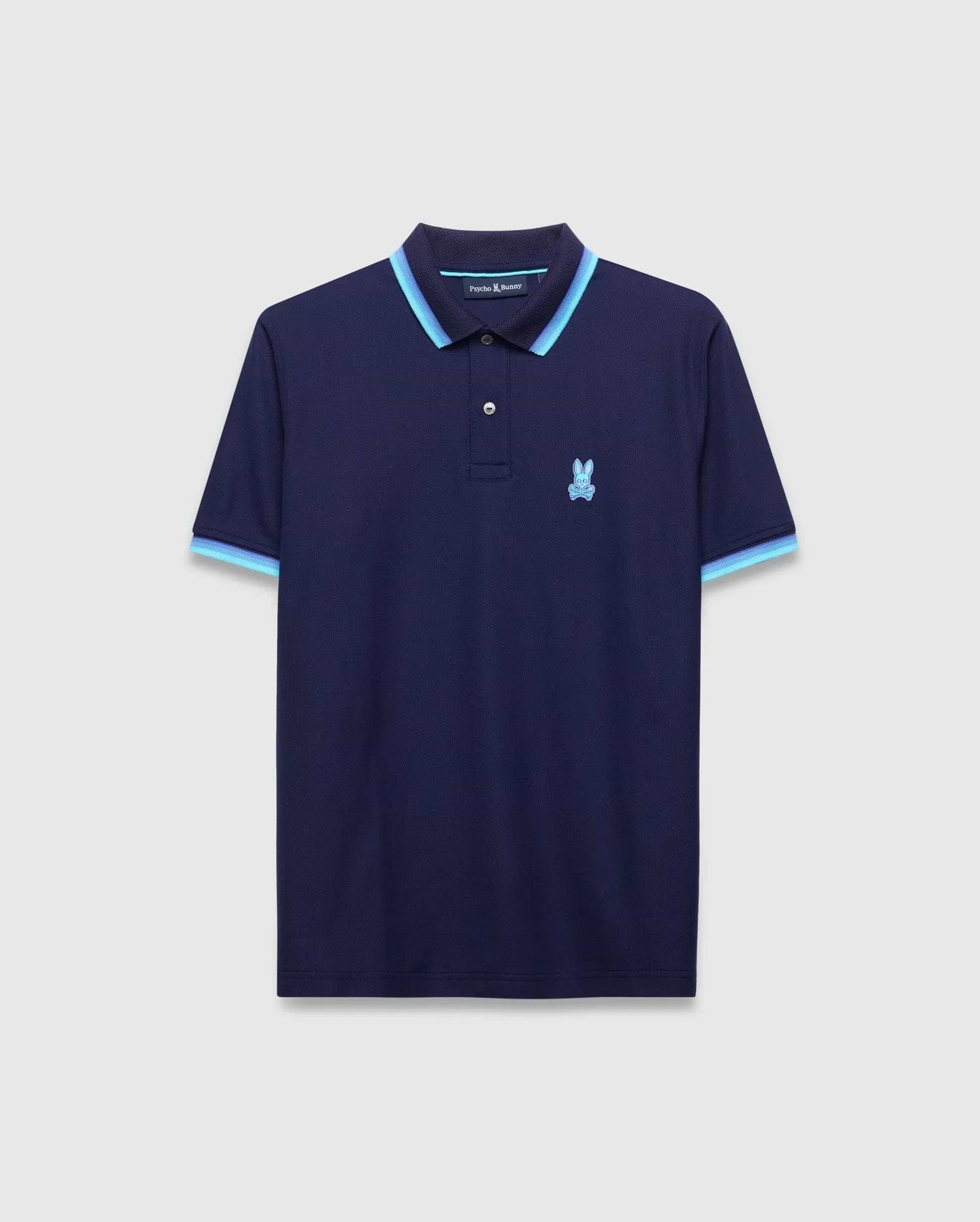 Mens Holden Pique Polo, classic fit navy pique knit polo with light blue and darker blue striped collar and cuffs, featuring a small embroidered light blue Psycho Bunny skull logo on the left chest. (5)