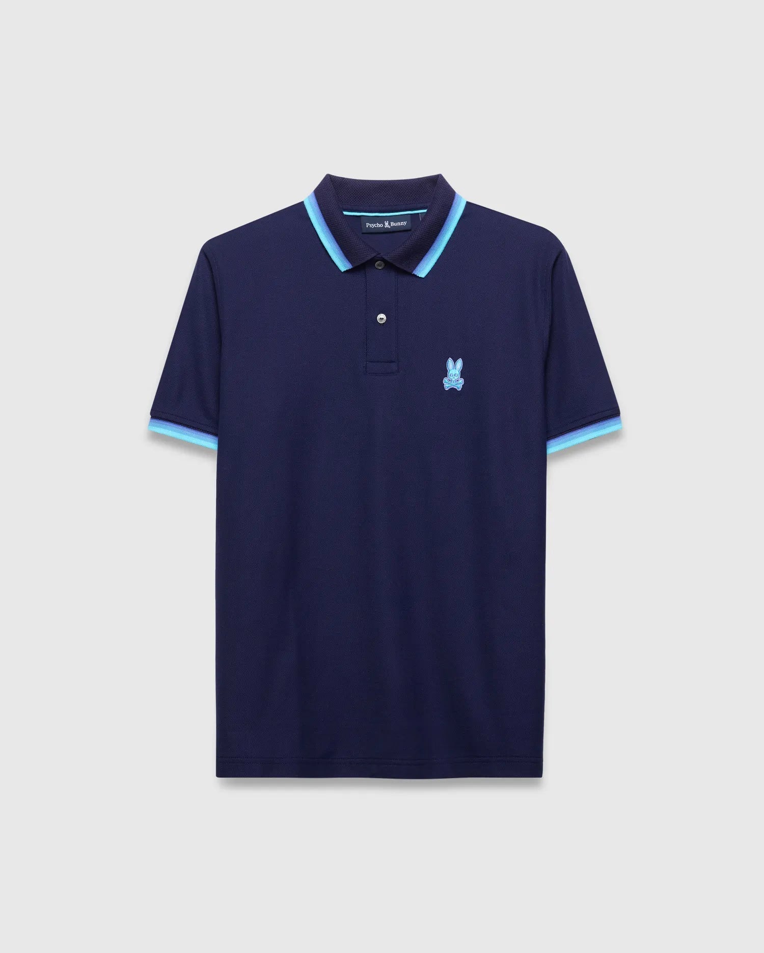 Mens Holden Pique Polo, classic fit navy pique knit polo with light blue and darker blue striped collar and cuffs, featuring a small embroidered light blue Psycho Bunny skull logo on the left chest. (5)