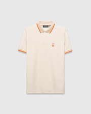 Mens Holden Pique Polo, a classic fit cream pique polo with orange and tan striped collar and cuffs, featuring a small embroidered orange Psycho Bunny skull logo on the left chest. (5)