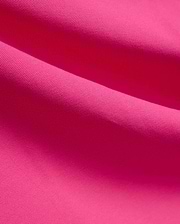 Vibrant fuchsia MENS NATE PIQUE POLO fabric, showcasing its classic textured pique knit weave, embodying Psycho Bunny's bold and refined streetwear style. (6)