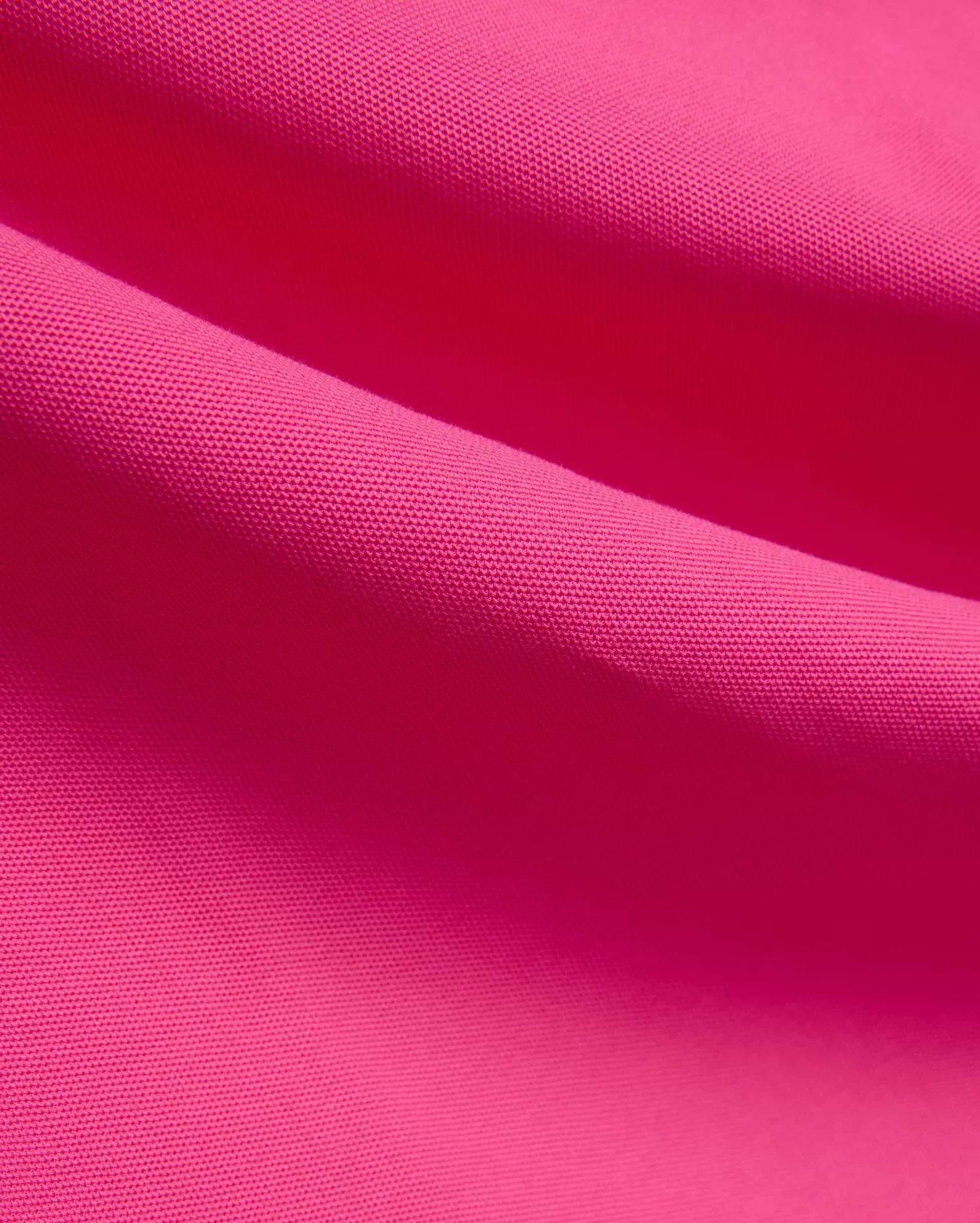 Vibrant fuchsia MENS NATE PIQUE POLO fabric, showcasing its classic textured pique knit weave, embodying Psycho Bunny's bold and refined streetwear style. (6)
