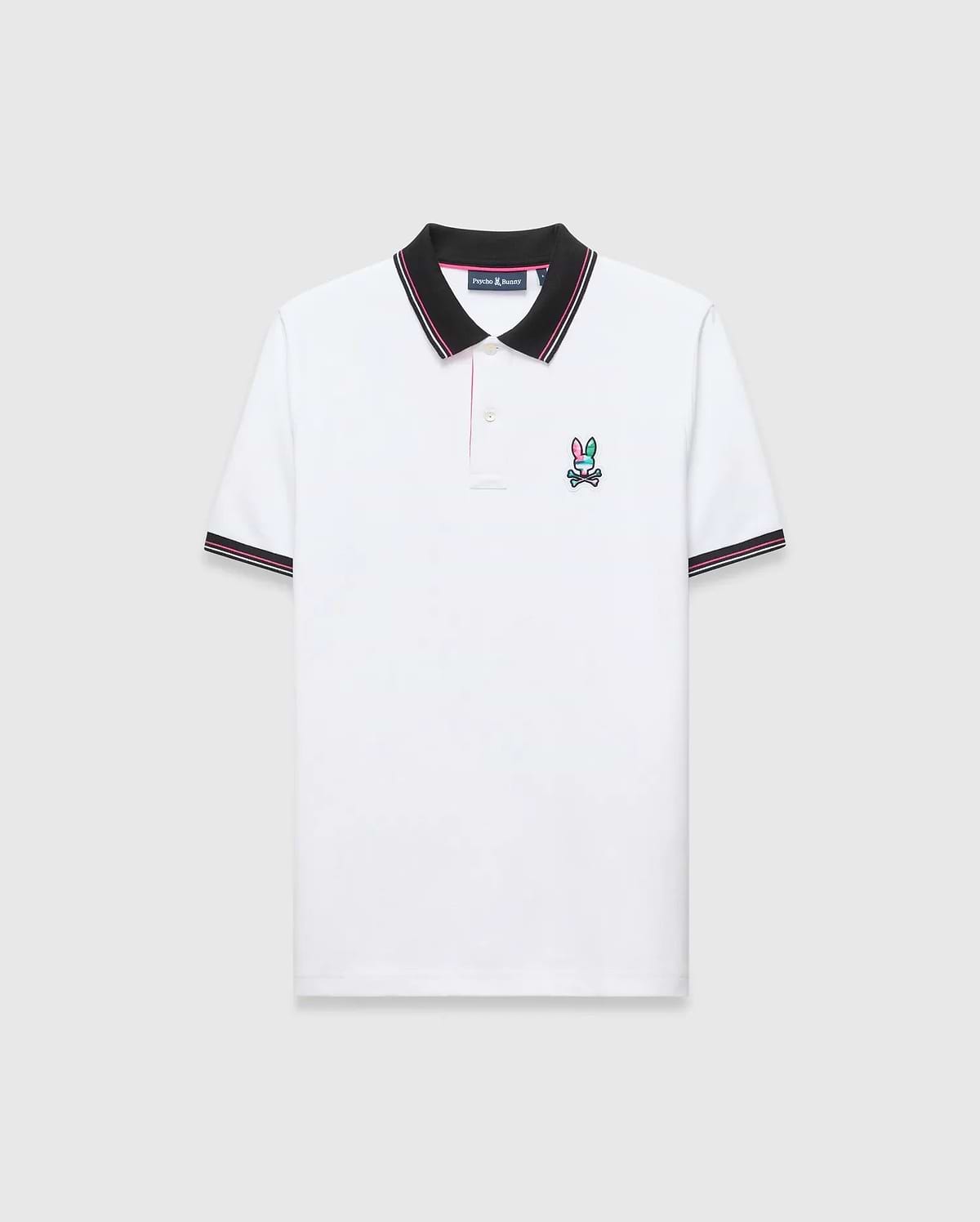 Mens Nate Pique Polo, classic fit, white pique fabric with a black ribbed collar and cuffs with pink/white stripes. A small, embroidered pink, teal, and black Psycho Bunny skull logo on the left chest.