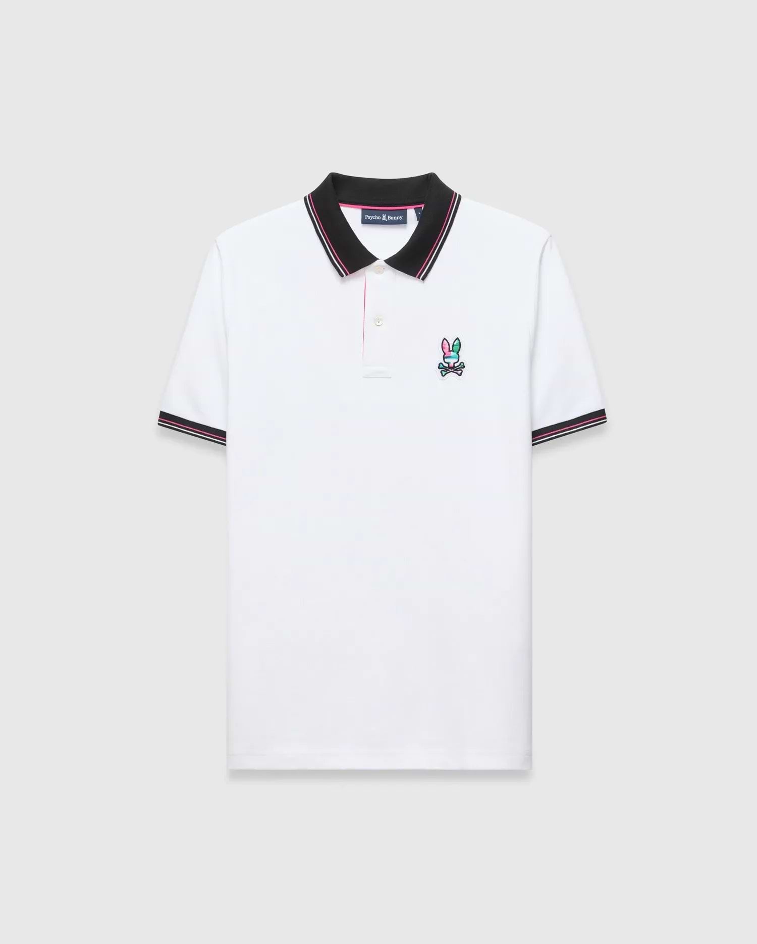 Mens Nate Pique Polo, classic fit, white pique fabric with a black ribbed collar and cuffs with pink/white stripes. A small, embroidered pink, teal, and black Psycho Bunny skull logo on the left chest.