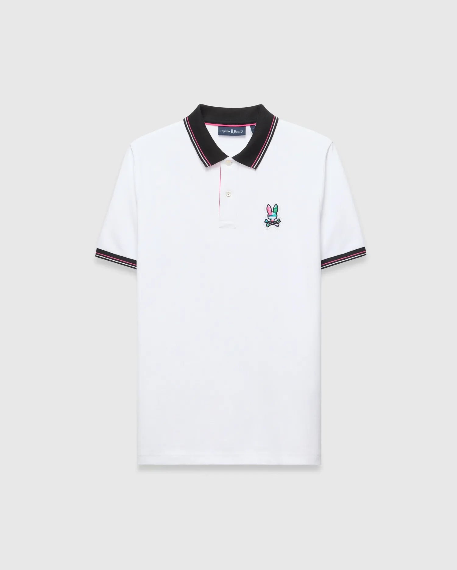 Mens Nate Pique Polo, classic fit, white pique fabric with a black ribbed collar and cuffs with pink/white stripes. A small, embroidered pink, teal, and black Psycho Bunny skull logo on the left chest.