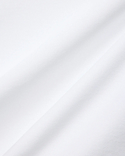 Mens Nate Pique Polo in crisp white, showcasing its premium, breathable, and finely textured pique fabric with subtle diagonal folds, embodying Psycho Bunny's refined streetwear aesthetic.