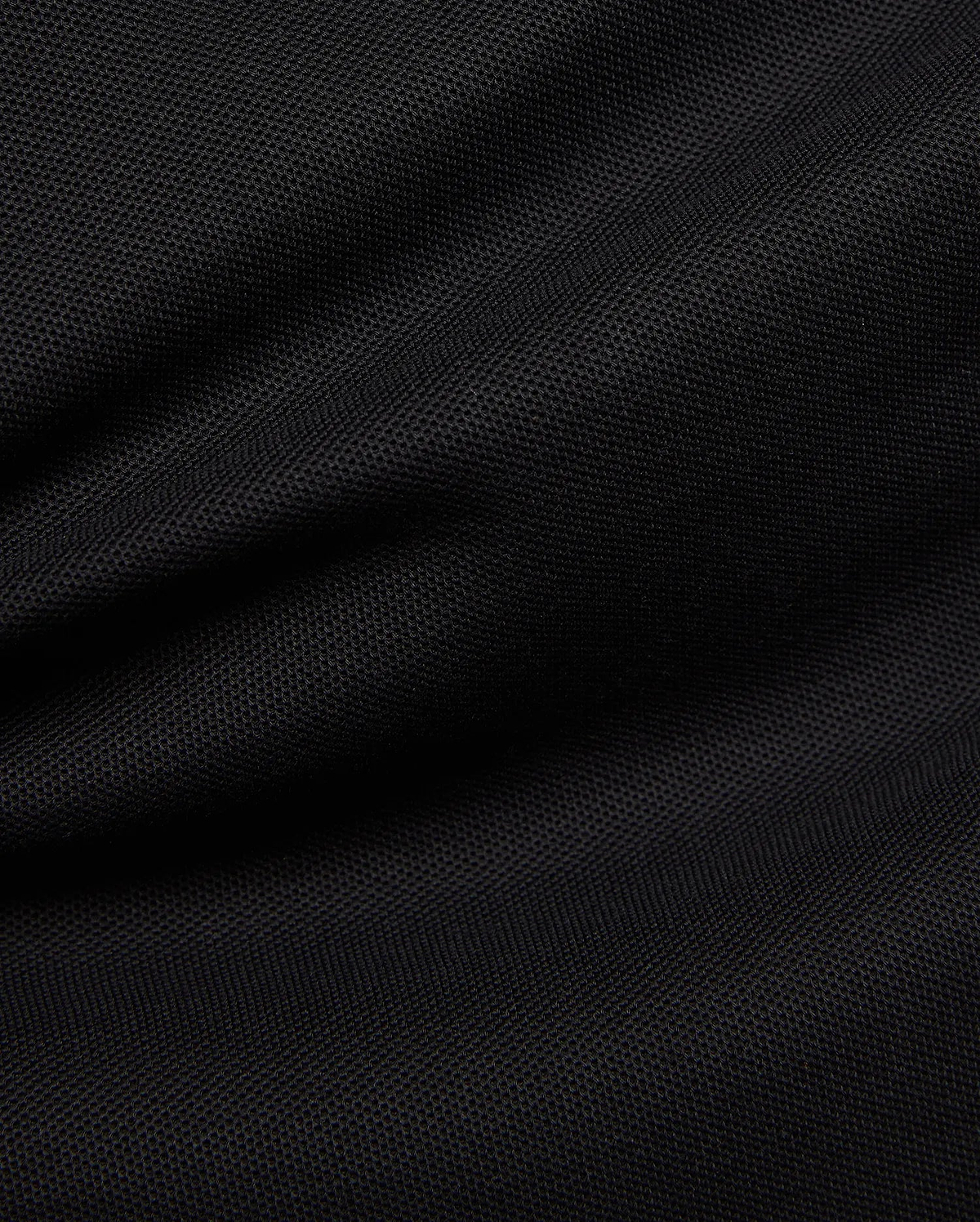 Premium black Mens Duncan Pique Polo, showcasing its breathable, classic pique fabric with a distinct textured weave and subtle folds, perfect for refined streetwear.