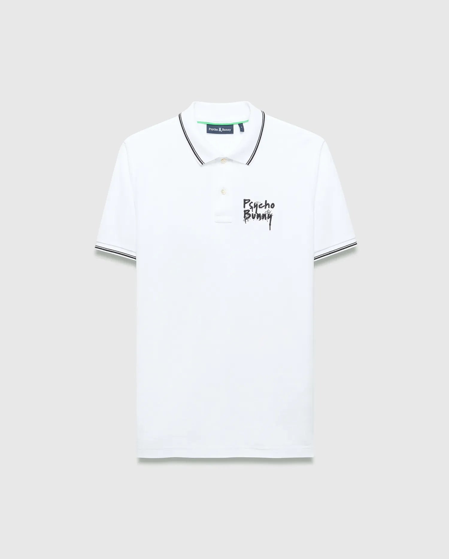 Mens Duncan Pique Polo, white classic fit pique polo with black striped collar and cuffs, featuring a distressed black Psycho Bunny text logo embroidered on the left chest and green neck tape.