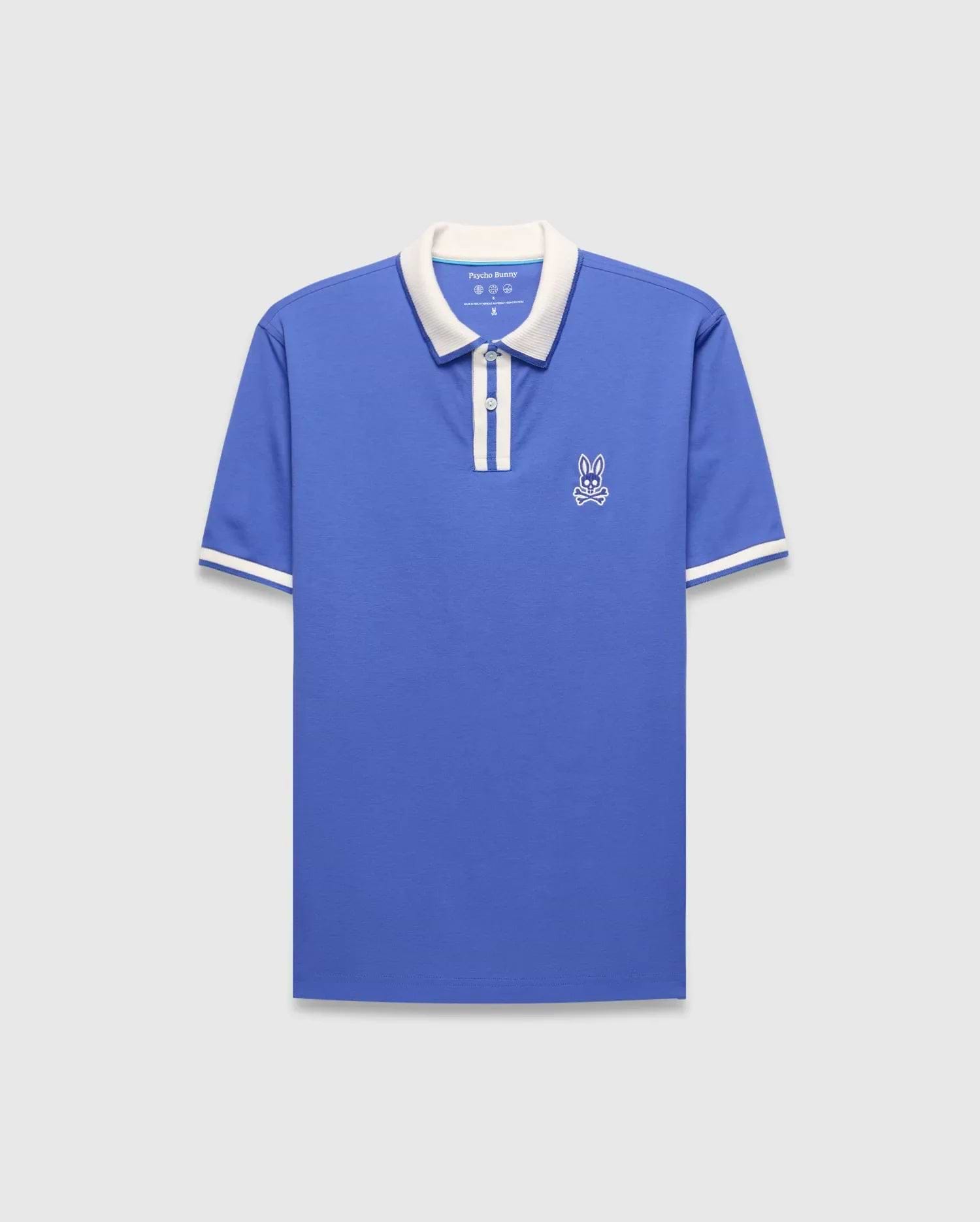 Mens Ridley Pique Polo in blue pique with a white collar, two-button placket, white striped cuffs, and an embroidered white Psycho Bunny skull logo on the left chest.