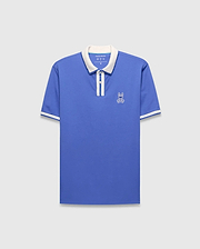 Mens Ridley Pique Polo in blue pique with a white collar, two-button placket, white striped cuffs, and an embroidered white Psycho Bunny skull logo on the left chest.