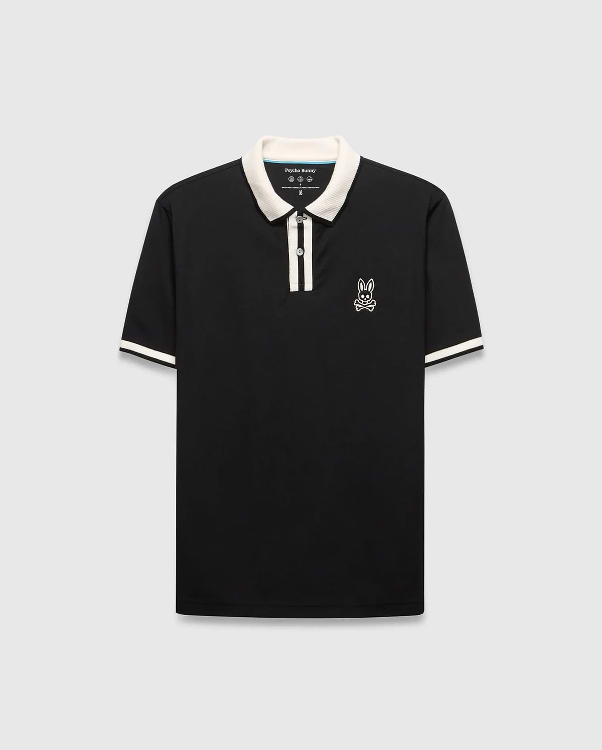 Mens Ridley Pique Polo, classic fit, black pique fabric with cream ribbed collar, two-button placket stripe, and cuff stripes. Features a white embroidered Psycho Bunny skull logo on the left chest. (4)