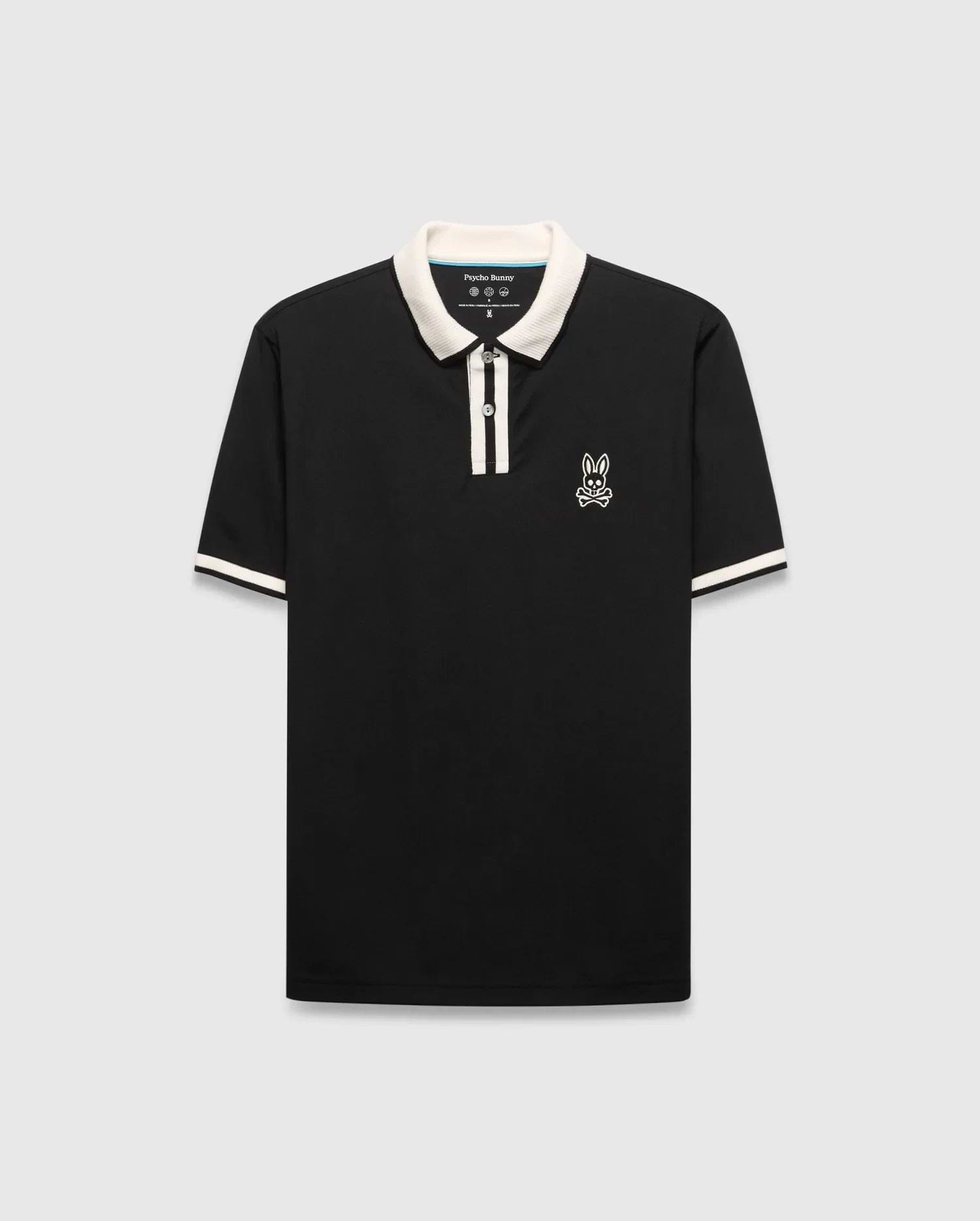 Mens Ridley Pique Polo, classic fit, black pique fabric with cream ribbed collar, two-button placket stripe, and cuff stripes. Features a white embroidered Psycho Bunny skull logo on the left chest. (4)