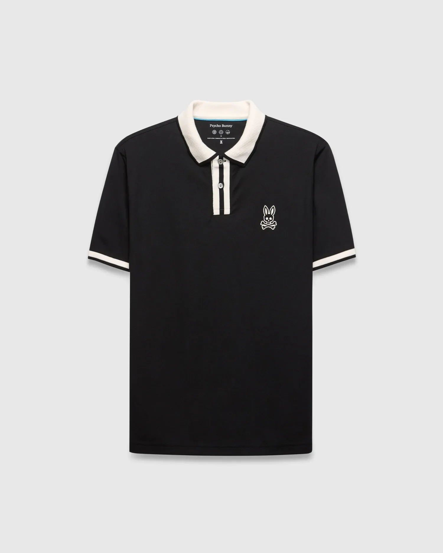 Mens Ridley Pique Polo, classic fit, black pique fabric with cream ribbed collar, two-button placket stripe, and cuff stripes. Features a white embroidered Psycho Bunny skull logo on the left chest. (4)