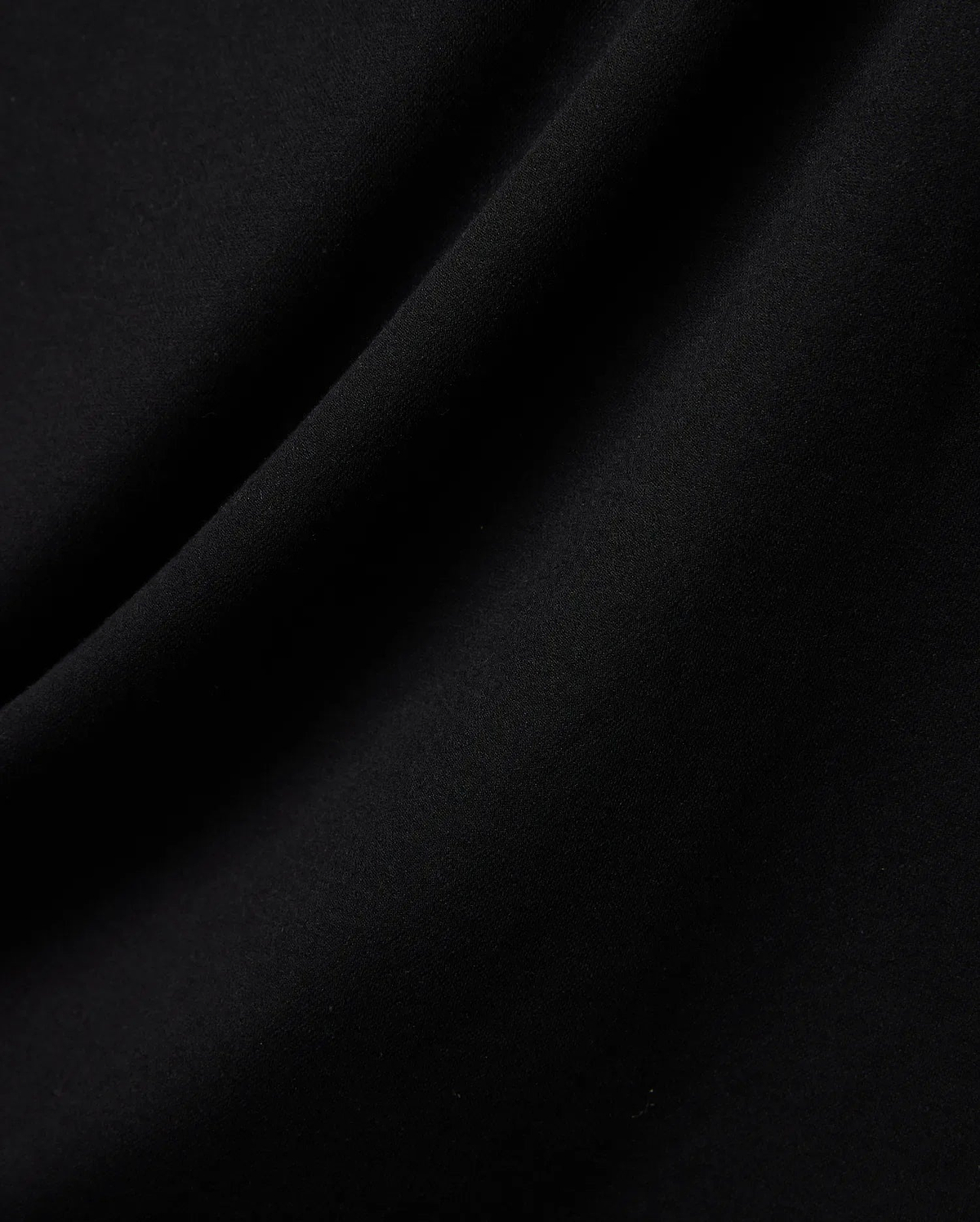 Mens Ridley Pique Polo in classic black, featuring the refined, breathable pique fabric texture with subtle folds, embodying premium Psycho Bunny streetwear. (5)