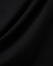Mens Ridley Pique Polo in classic black, featuring the refined, breathable pique fabric texture with subtle folds, embodying premium Psycho Bunny streetwear. (5)
