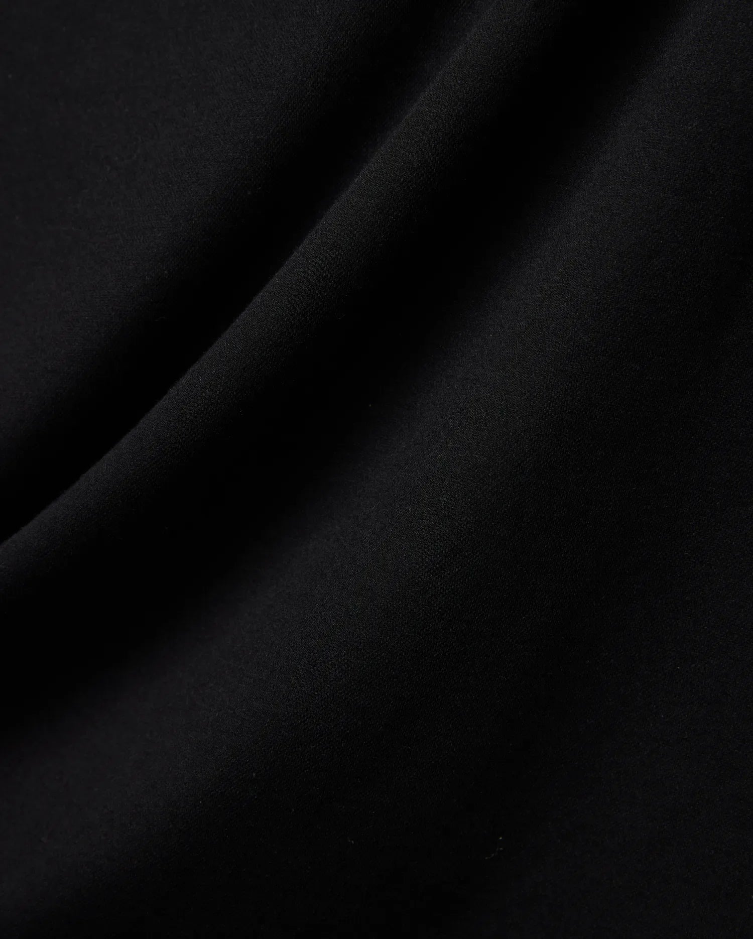 Mens Ridley Pique Polo in classic black, featuring the refined, breathable pique fabric texture with subtle folds, embodying premium Psycho Bunny streetwear. (5)