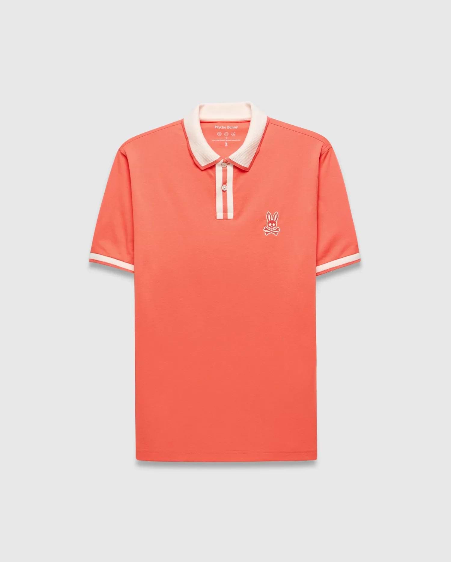 Mens Ridley Pique Polo in coral pique, featuring a classic fit, cream ribbed collar and cuffs with stripes, a two-button placket with cream stripe, and an embroidered white Psycho Bunny skull logo on the left chest. (6)