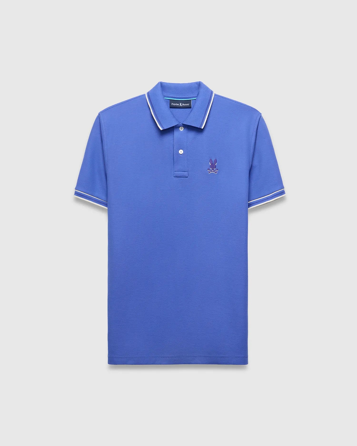 Mens Brad Pique Polo in vibrant blue, classic fit, with white tipped collar and sleeves, featuring a small purple embroidered Psycho Bunny skull logo on the left chest.