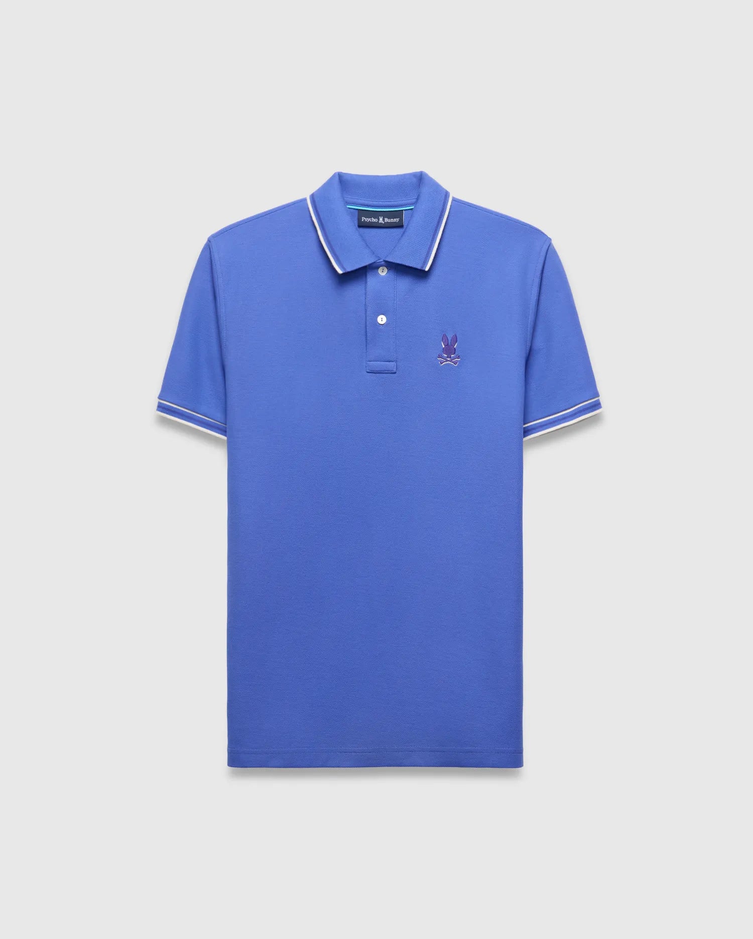 Mens Brad Pique Polo in vibrant blue, classic fit, with white tipped collar and sleeves, featuring a small purple embroidered Psycho Bunny skull logo on the left chest.