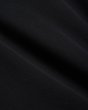 Mens Brad Pique Polo, a premium black pique knit fabric with a subtle, textured weave, showcasing the refined quality and classic style of Psycho Bunny menswear. (6)