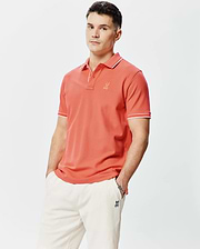 Mens Brad Pique Polo in coral, featuring a classic fit, pique knit fabric, white tipping on the collar and sleeve cuffs, and a small embroidered Psycho Bunny skull logo on the left chest. (1)