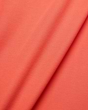 Mens Brad Pique Polo in vibrant coral, showcasing a refined pique knit texture. This premium Psycho Bunny polo features the iconic embroidered bunny skull logo on the chest. (6)