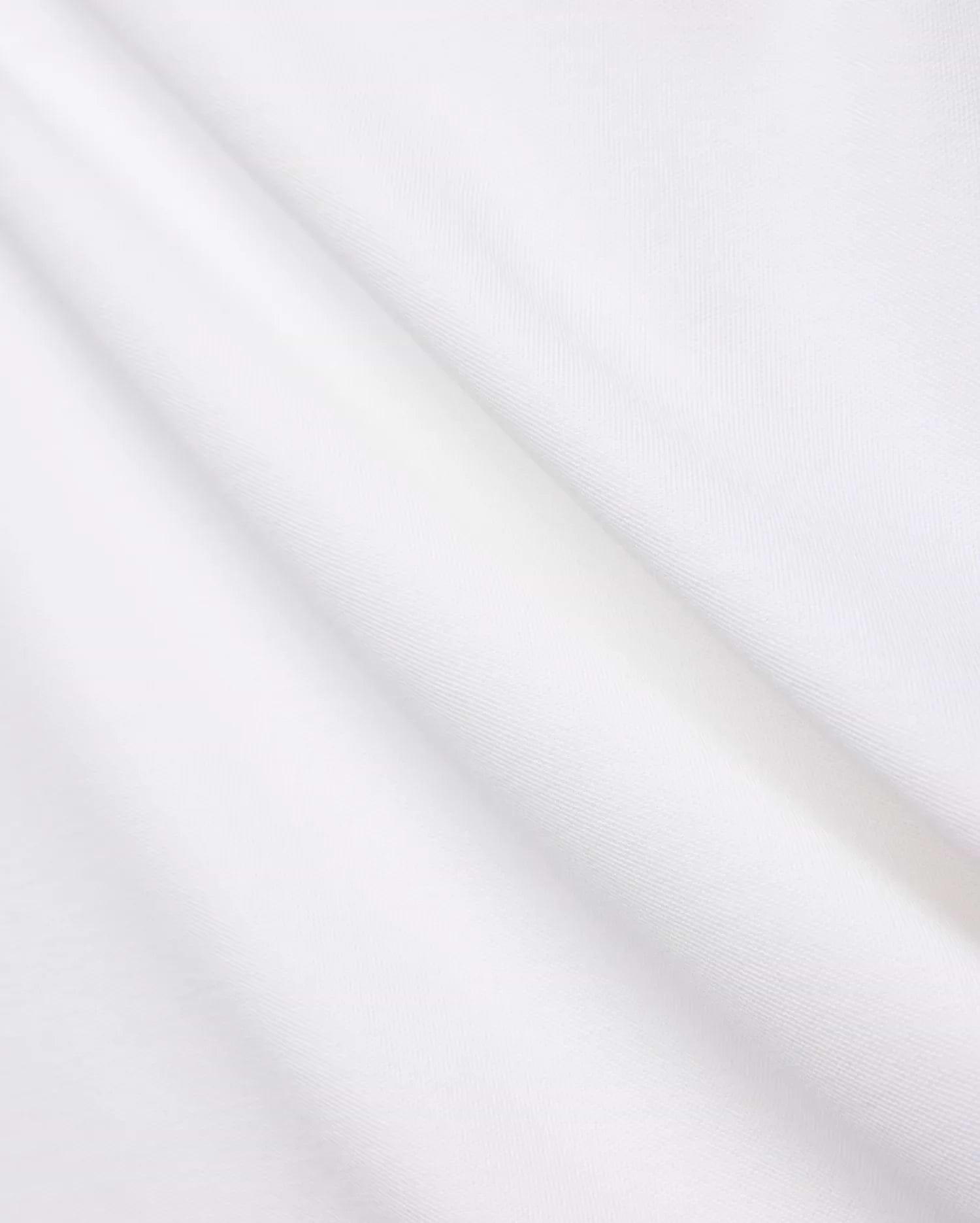 Crisp White Mens Brad Pique Polo fabric, highlighting its distinctive textured pique weave, soft, luxurious feel, and elegant folds, embodying premium Psycho Bunny menswear.