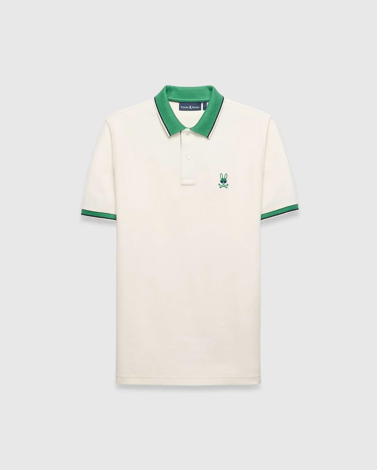Mens Sunny Pique Polo, cream classic fit pique knit with a green collar and striped cuffs, featuring a small embroidered green Psycho Bunny skull logo on the left chest.