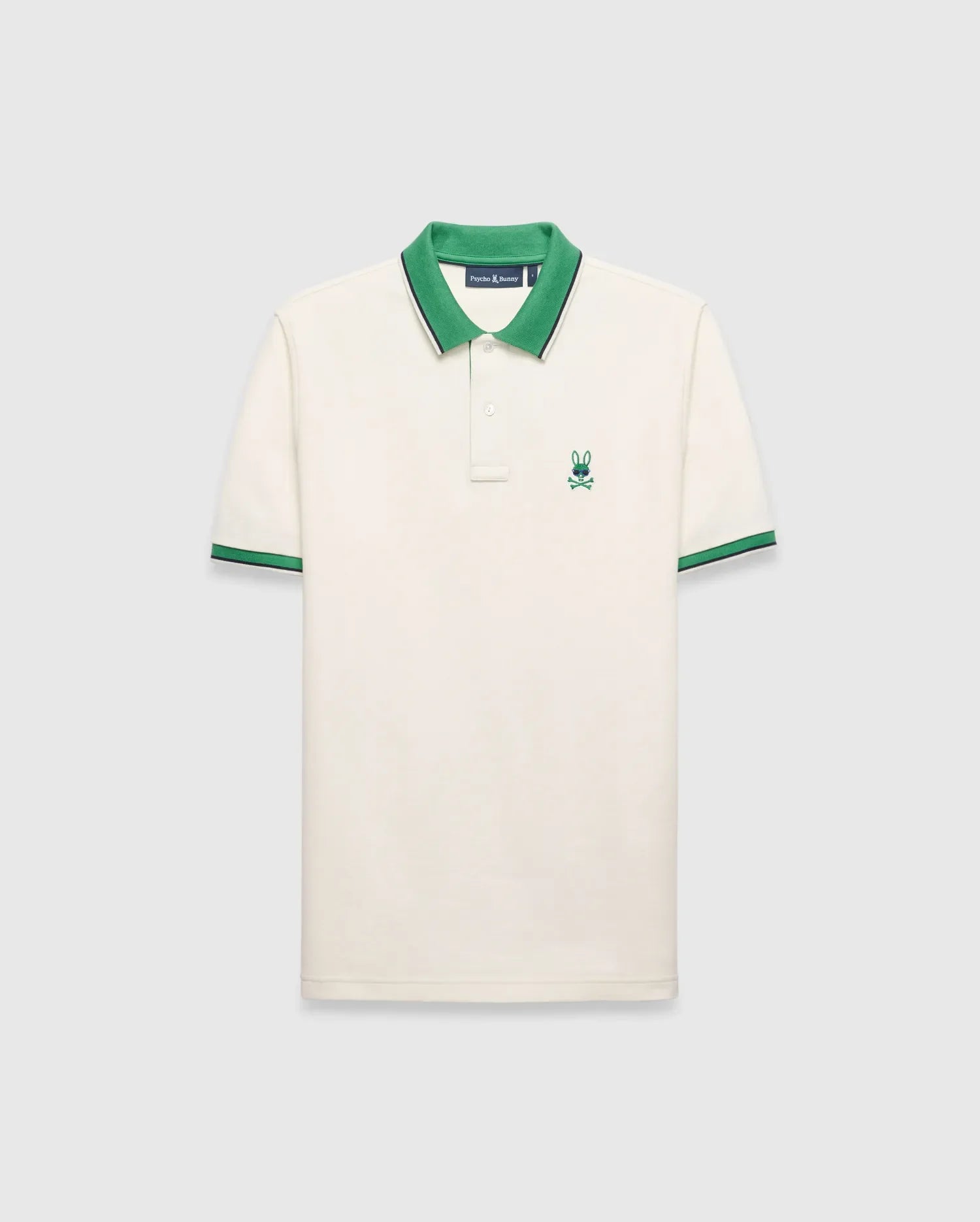 Mens Sunny Pique Polo, cream classic fit pique knit with a green collar and striped cuffs, featuring a small embroidered green Psycho Bunny skull logo on the left chest.