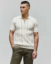 Mens Cliff Knit Zip Polo, cream and beige striped ribbed knit, classic fit, with a Psycho Bunny skull zipper pull and embroidered logo on the left chest.