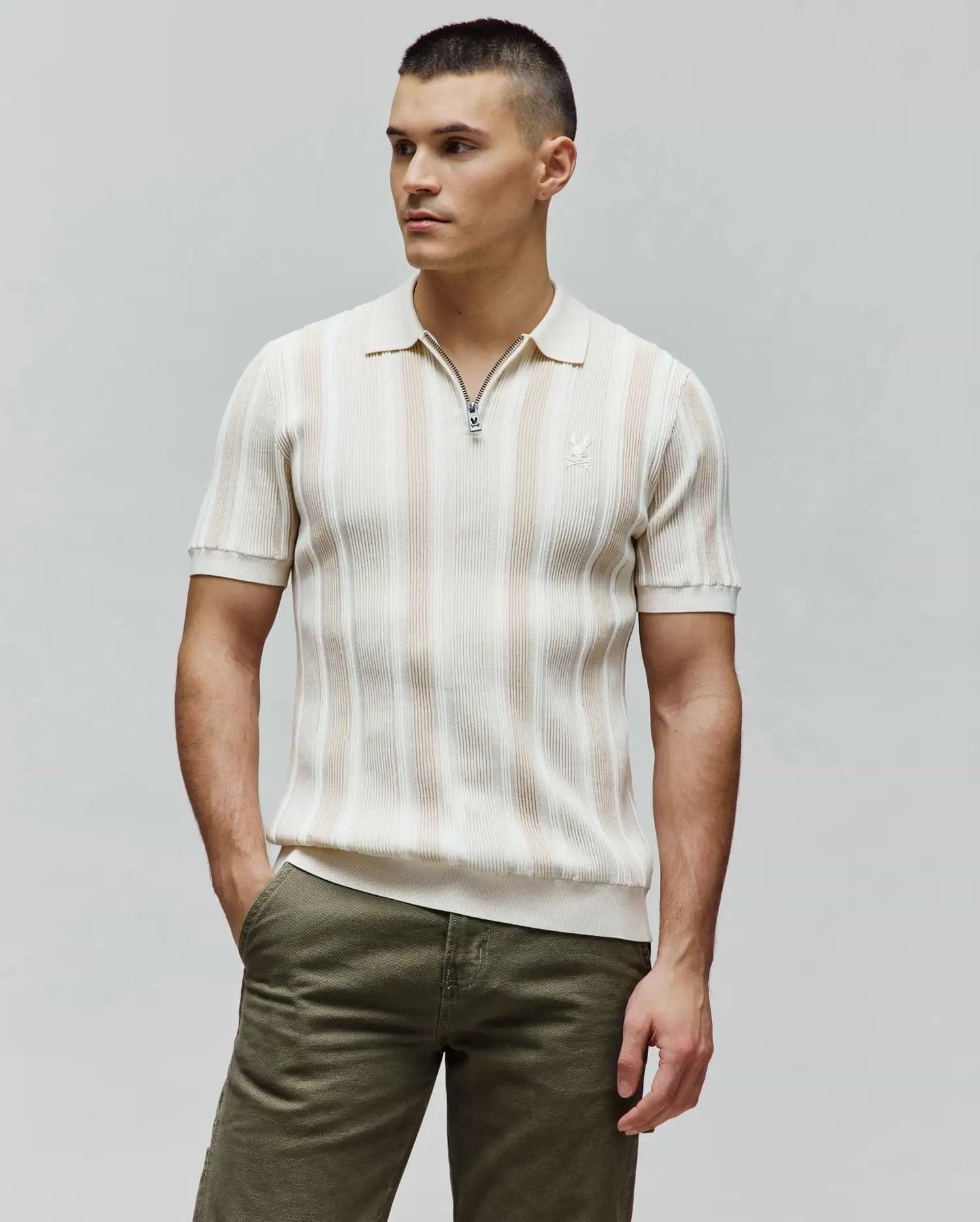 Mens Cliff Knit Zip Polo, cream and beige striped ribbed knit, classic fit, with a Psycho Bunny skull zipper pull and embroidered logo on the left chest.