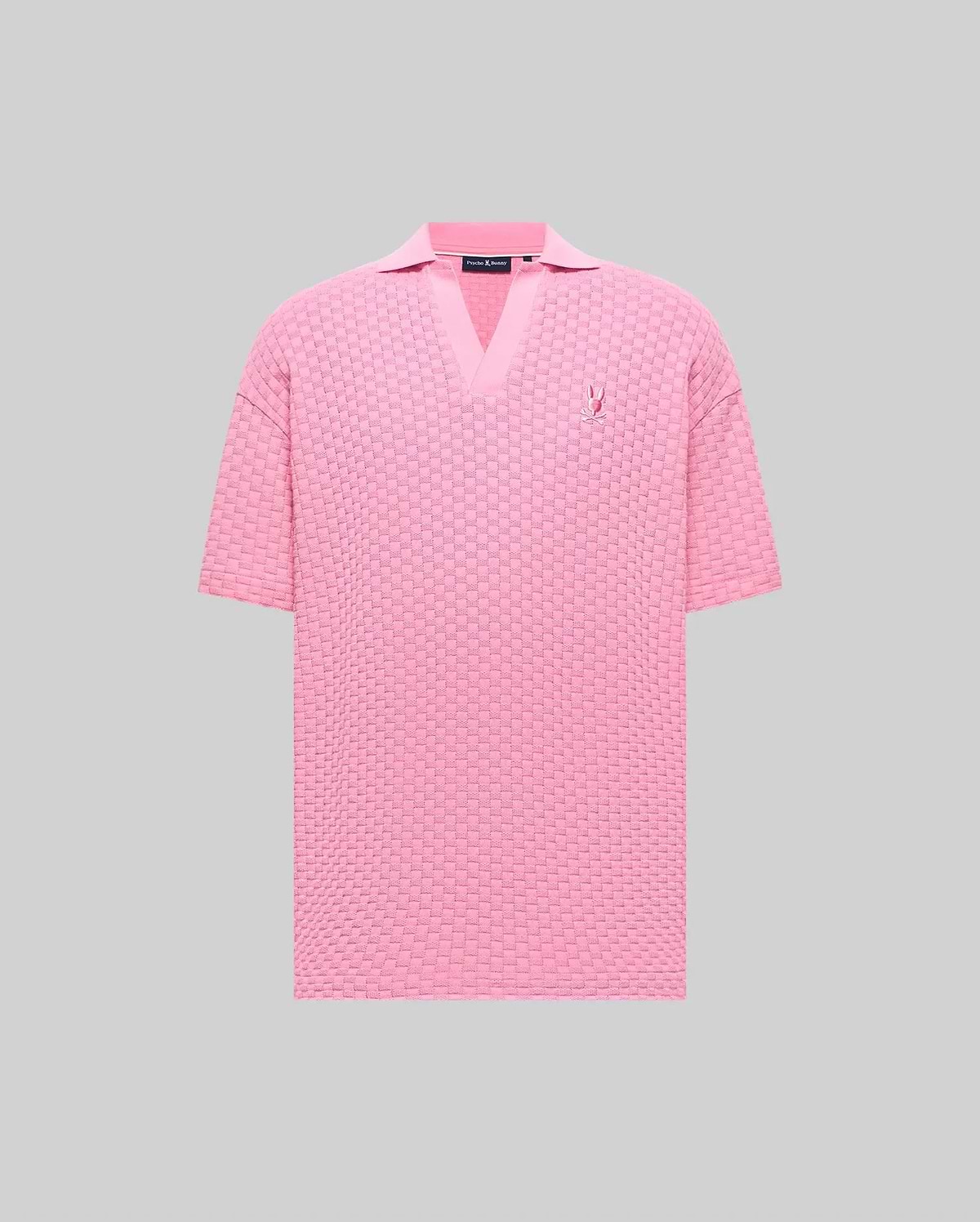Mens Garen Knit Polo in pink, featuring a relaxed fit, textured basketweave knit, V-neck collar, and a small embroidered pink Psycho Bunny skull logo on the left chest. (5)