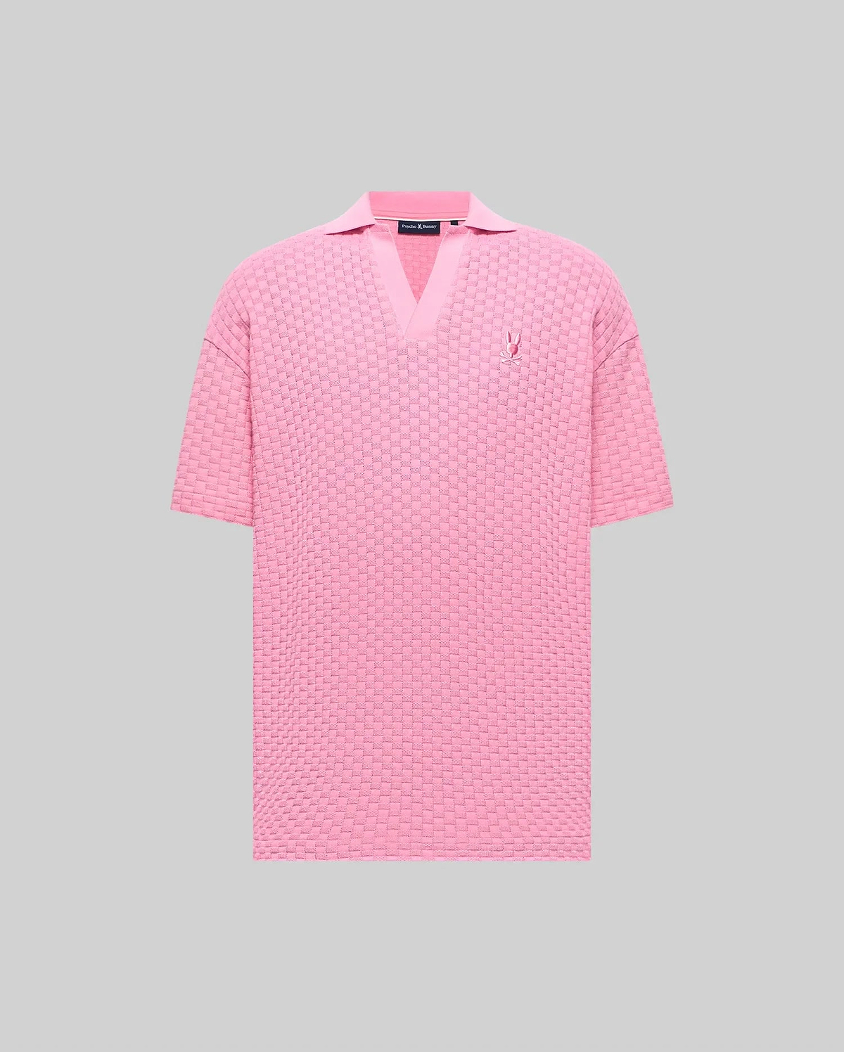 Mens Garen Knit Polo in pink, featuring a relaxed fit, textured basketweave knit, V-neck collar, and a small embroidered pink Psycho Bunny skull logo on the left chest. (5)