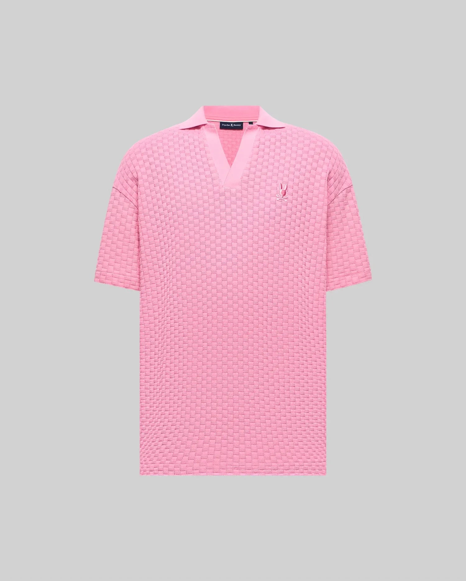 Mens Garen Knit Polo in pink, featuring a relaxed fit, textured basketweave knit, V-neck collar, and a small embroidered pink Psycho Bunny skull logo on the left chest. (5)