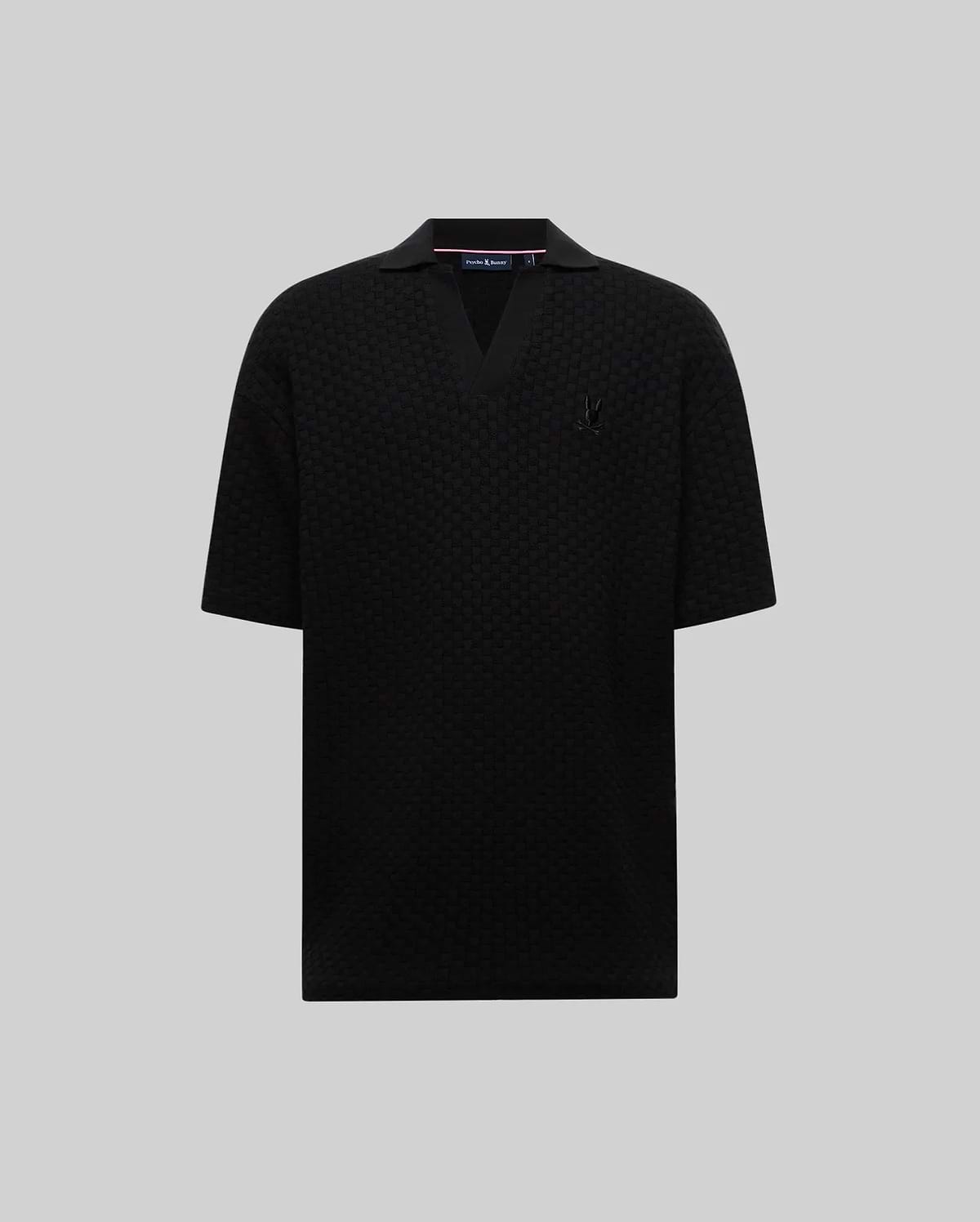Mens Garen Knit Polo, a black relaxed fit textured knit polo with an open V-neck collar and a small embroidered black Psycho Bunny skull logo on the left chest. (4)