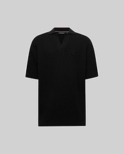 Mens Garen Knit Polo, a black relaxed fit textured knit polo with an open V-neck collar and a small embroidered black Psycho Bunny skull logo on the left chest. (4)