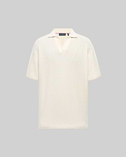Mens Garen Knit Polo in cream, featuring a relaxed fit, textured knit fabric with a subtle grid pattern, spread collar, and a small, tonal embroidered Psycho Bunny skull on the left chest. (4)