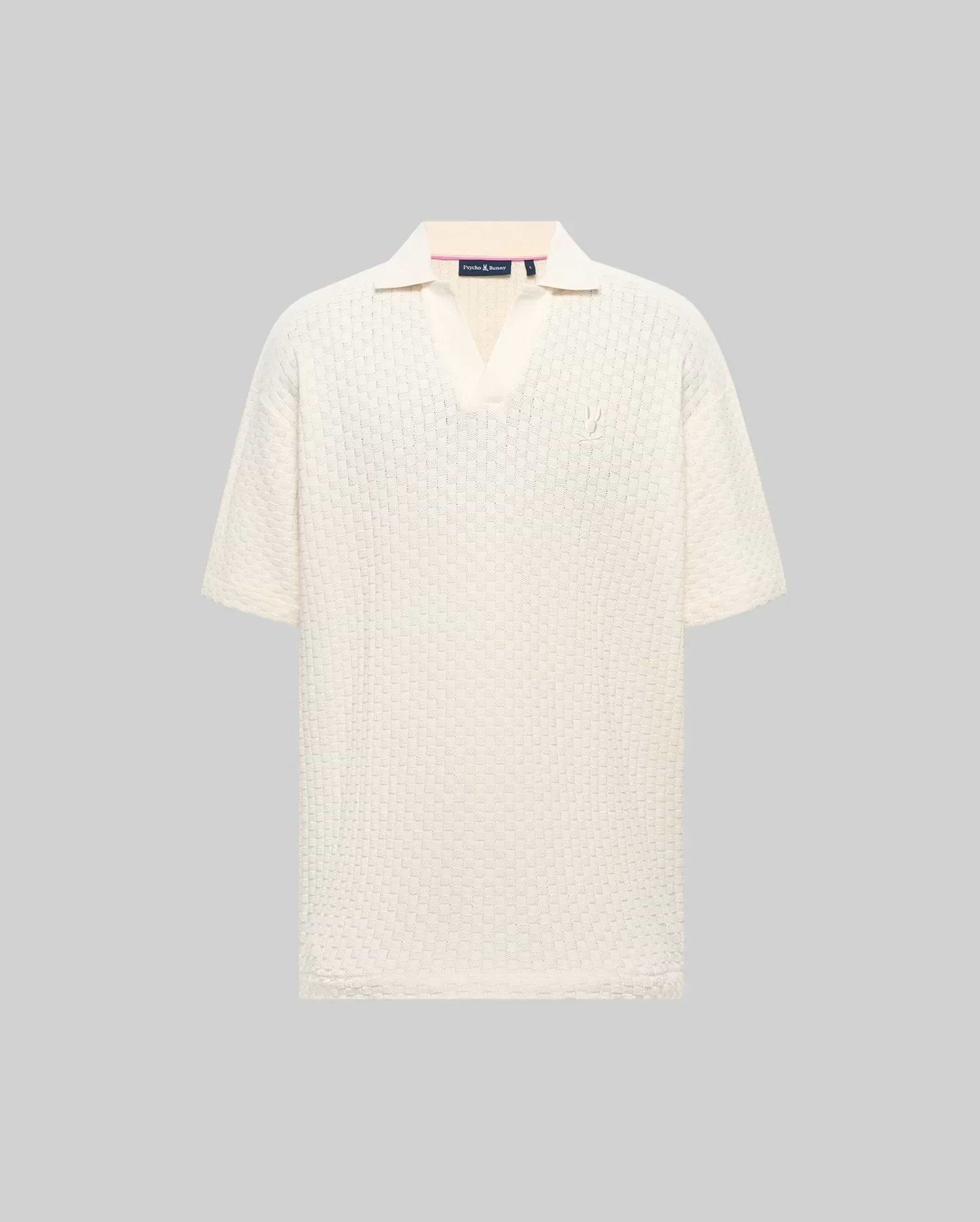 Mens Garen Knit Polo in cream, featuring a relaxed fit, textured knit fabric with a subtle grid pattern, spread collar, and a small, tonal embroidered Psycho Bunny skull on the left chest. (4)