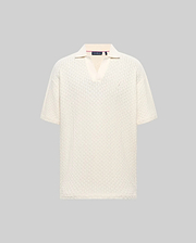 Mens Garen Knit Polo in cream, featuring a relaxed fit, textured knit fabric with a subtle grid pattern, spread collar, and a small, tonal embroidered Psycho Bunny skull on the left chest. (4)