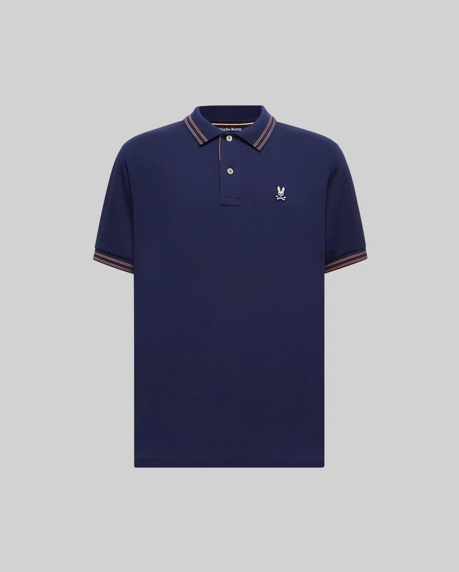 Mens Kenyon Pique Polo in navy blue pique knit, featuring a classic fit, embroidered white Psycho Bunny skull logo on the left chest, and orange-white striped ribbed collar and cuffs. (4)