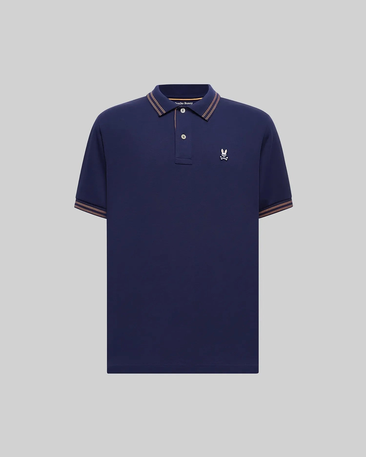 Mens Kenyon Pique Polo in navy blue pique knit, featuring a classic fit, embroidered white Psycho Bunny skull logo on the left chest, and orange-white striped ribbed collar and cuffs. (4)