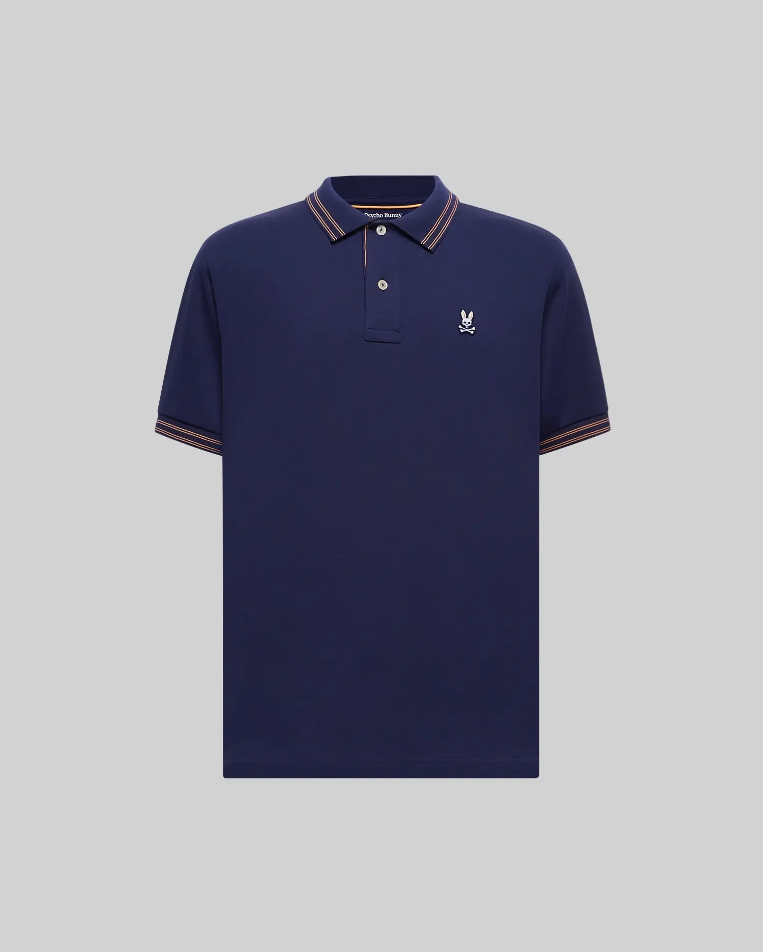 Mens Kenyon Pique Polo in navy blue pique knit, featuring a classic fit, embroidered white Psycho Bunny skull logo on the left chest, and orange-white striped ribbed collar and cuffs. (4)