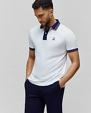 Mens Kenyon Pique Polo, white classic fit pique polo with navy collar, purple striped cuffs, and small embroidered Psycho Bunny skull logo on left chest.