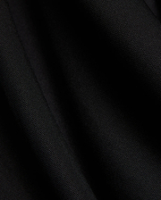 Mens Odin Zip Sport Polo in a rich black, featuring a visible premium pique knit fabric texture, characteristic of Psycho Bunny's refined streetwear style.