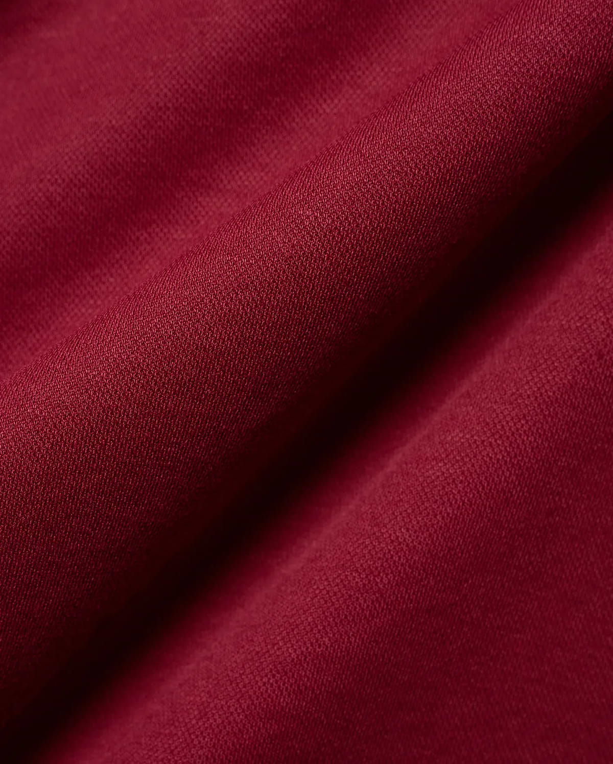 Mens Timmy Interlock Polo in a luxurious deep burgundy, highlighting the premium, smooth interlock knit fabric with its refined, subtle texture and elegant, soft drape.