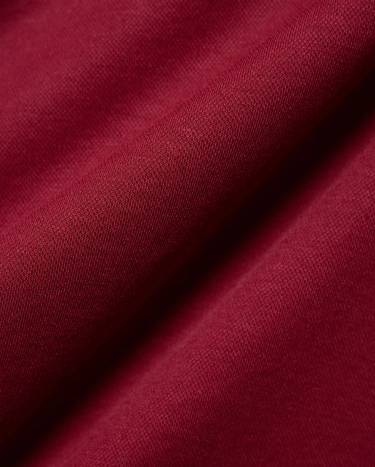 Mens Timmy Interlock Polo in a luxurious deep burgundy, highlighting the premium, smooth interlock knit fabric with its refined, subtle texture and elegant, soft drape.