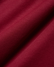 Mens Timmy Interlock Polo in a luxurious deep burgundy, highlighting the premium, smooth interlock knit fabric with its refined, subtle texture and elegant, soft drape.