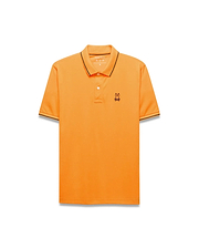 Mens Joji Performance Polo in vibrant orange, featuring a classic fit, smooth jersey fabric, black tipping on the collar and cuffs, and a small embroidered Psycho Bunny skull logo on the left chest. (4)