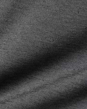 Psycho Bunny MENS JOJI PERFORMANCE POLO in a deep charcoal grey, featuring a premium, subtly textured pique knit fabric, offering a refined streetwear aesthetic and classic fit.
