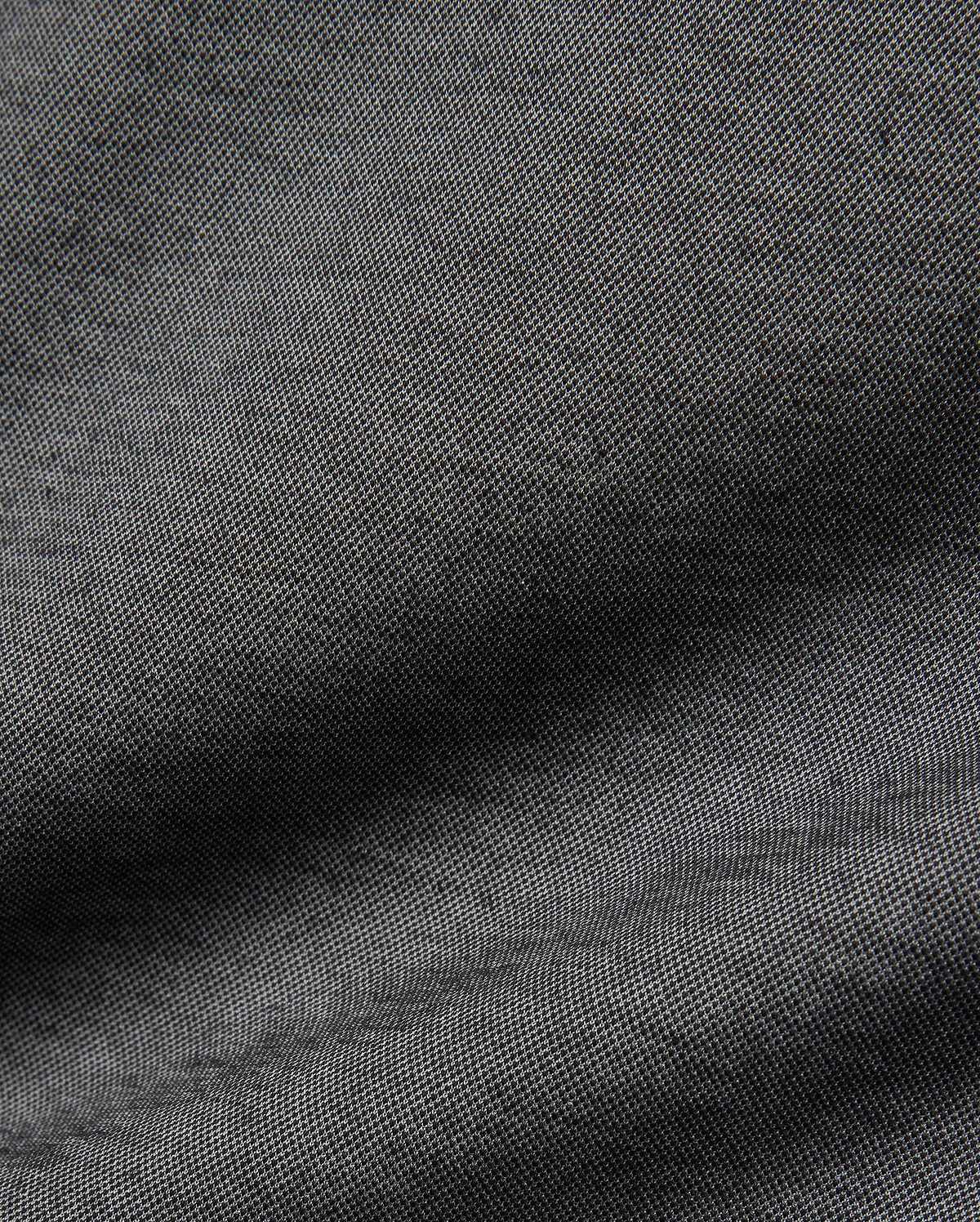 Psycho Bunny MENS JOJI PERFORMANCE POLO in a deep charcoal grey, featuring a premium, subtly textured pique knit fabric, offering a refined streetwear aesthetic and classic fit.